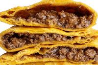 a stack of fried empanadas with meat inside